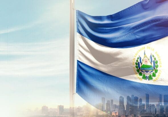 El,Salvador,National,Flag,Wavering,In,Beautiful,Clouds,With,Building