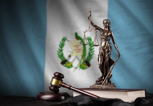 Guatemala,Flag,With,Statue,Of,Lady,Justice,,Constitution,And,Judge