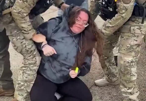 18v--minneapolis--this-woman-allegedly-hit-a-vehicle-with-agents-inside---frame-at-0m2s